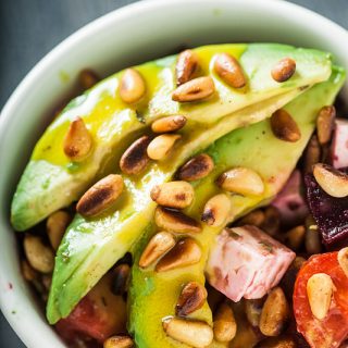 Recipe for a creamy avocado salad with roasted Pine Seeds, Beetroot, Tomato, Feta Cheese and a rich and hearty tahini dressing. Recipe and Foodstyling from Purple Avocado