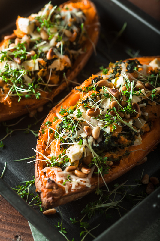 Recipe for stuffed sweet potato with spinach, feta cheese, parmesan and pine seeds. Comforting, simple and delicious!