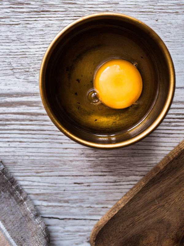 Breakfast becomes dinner with this savoury porridge with avocado, poached egg and roasted sea weed. Recipe and food styling from purple avocado / sabrina dietz.