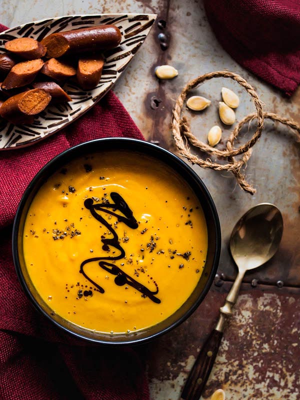 Vegan coconut pumpkin soup with maple syrup and curry. We're adding vegan merguez by Wheaty for the salty touch and bite. #recipe #foodstyling #fall #autumn #recipes #pumpkin #hokkaido