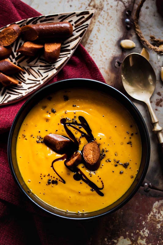Vegan coconut pumpkin soup with maple syrup and curry. We're adding vegan merguez by Wheaty for the salty touch and bite. #recipe #foodstyling #fall #autumn #recipes #pumpkin #hokkaido