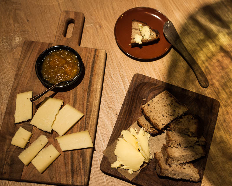 15 month aged cheese from the Allgäu with homemade bread and butter. Hygge - Restaurant Guide Hamburg
