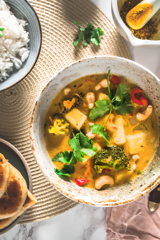 Recipe for vegan coconut curry with pineapple and cashews. #golden #curry #yellow #vegetarian #vegan #indian #thai #recipe