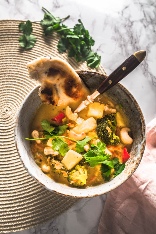 Recipe for vegan coconut curry with pineapple and cashews. #golden #curry #yellow #vegetarian #vegan #indian #thai #recipe
