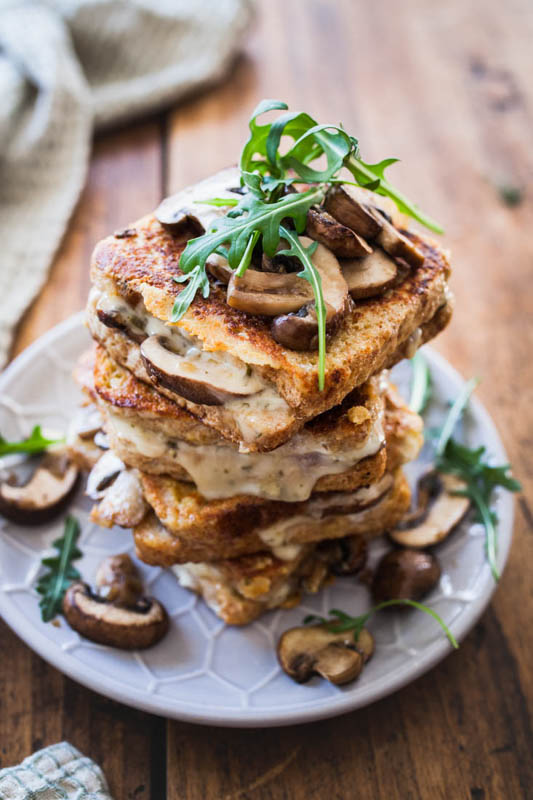 Savoury French toast? Yes please! This hearty version doesn't have to hide in front of its sweet brother. We're going all savoury and umami with fried mushrooms, melted cheese and a hint of cashew butter. Perfect for a long and cozy Sunday breakfast. #breakfast #frenchtoast #vegetarian